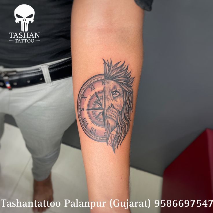 Lion with compass tattoo