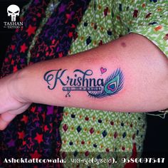 krishna name with peacock feather tattoo