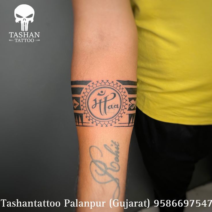 Maapaa with geometric armband tattoo